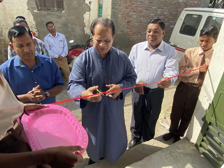 IGO President Valson Abraham cuts the ribbon and dedicates brand-new facilities for the “dairy complex” Asha Kiran school in Ludhiana, Punjab. On the right is Pastor K. Koshy, Director, IGO Northwest India.