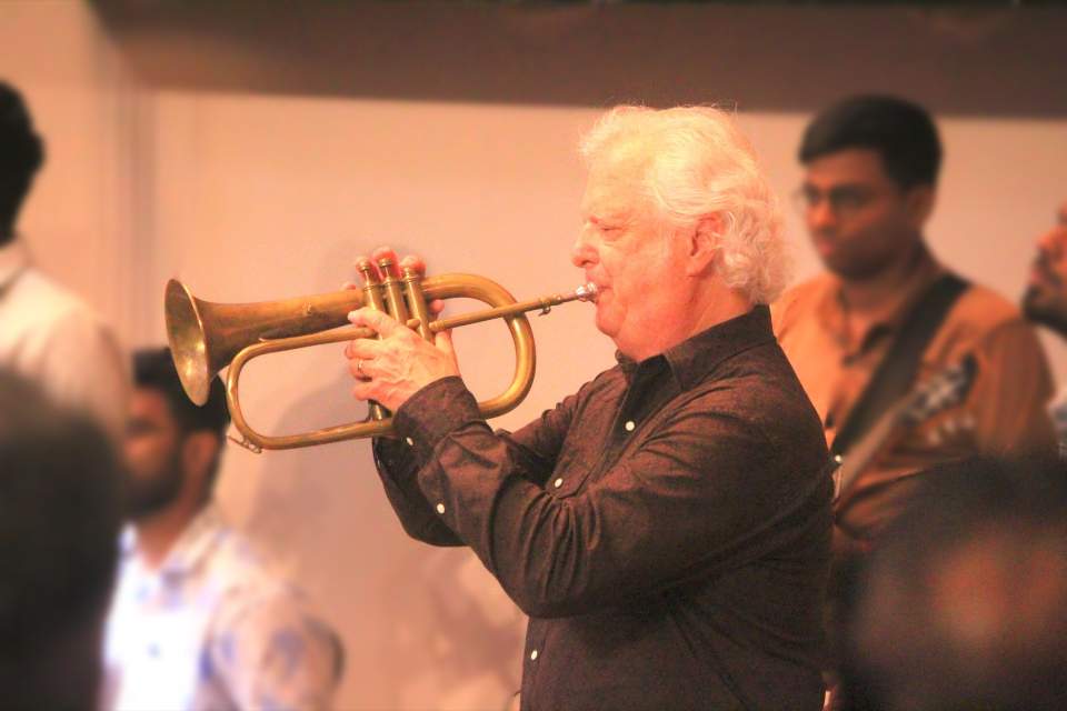 Fletch Wiley, known for his musical versatility and worshipful approach toward music, plays a flugelhorn, related to the trumpet but with a more mellow sound.