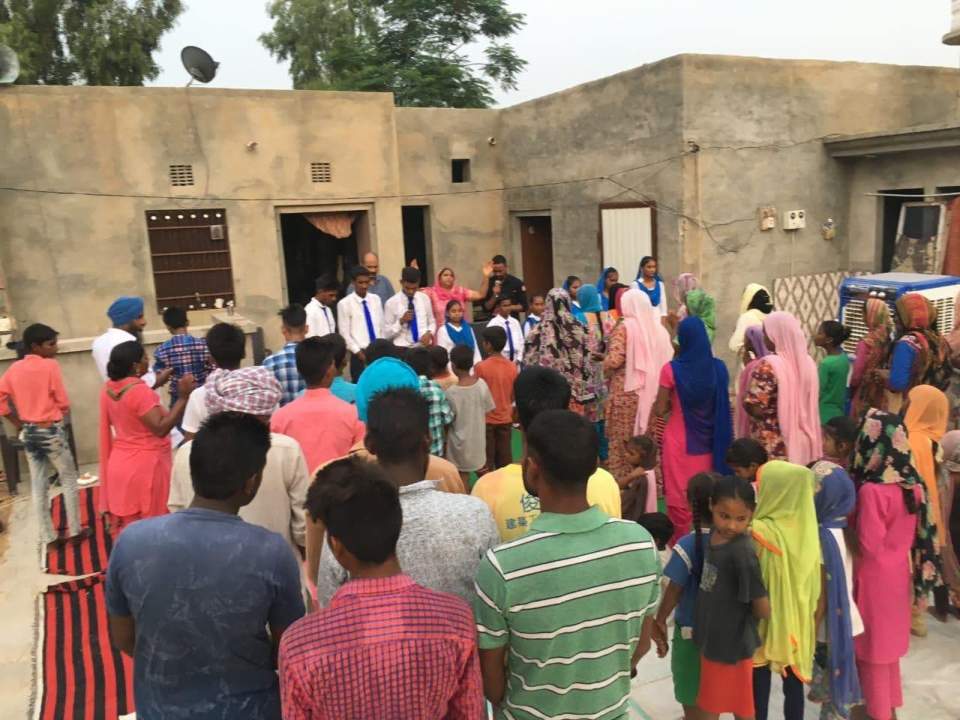 A special prayer gathering of people from Pastor Singh’s congregation.